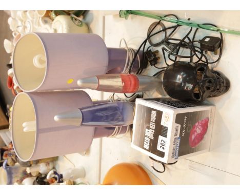 Two contemporary lava lamps, Sound Lab skull lighter and a pair of ceramic based bedside lights.This lot is not available for