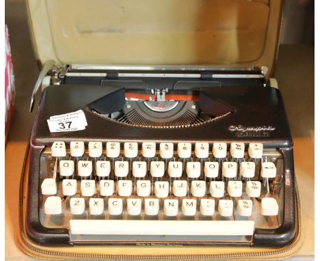 Olympia portable cased typewriter. P&amp;P Group 2 (£18+VAT for the first lot and £2+VAT for subsequent lots) 