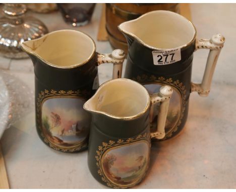 Three handed painted graduated jugs. P&amp;P Group 1 (£14+VAT for the first lot and £1+VAT for subsequent lots) 