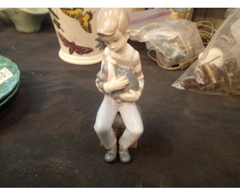 Nao boy with puppy figurine, H: 18 cm.  Condition report: Requires extensive restoration to the head.P&P Group 1 (£14+VAT for