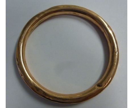 A 9ct gold, hollow bangle