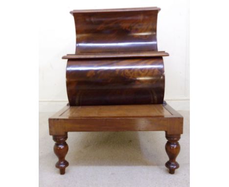 A late Victorian walnut step commode, having three tooled gilt brown hide treads and a rising top, over a retractable step, e
