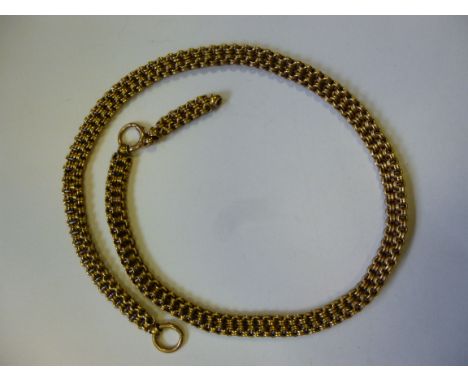 A gold coloured metal, conjoined double row, multi-ring necklace