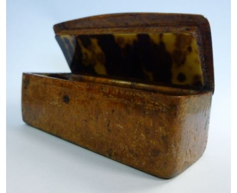 An early 19thC casket shaped, faux walnut veneered papier mache snuff box, the hinged lid enclosing a naturalistically colour
