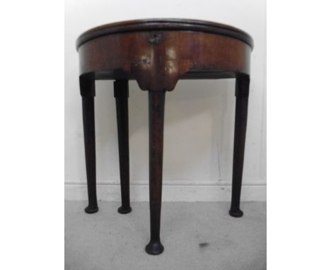 A late 18th/early 19thC figured mahogany demi-lune tea table, the double hinged top having a round edge, enclosing a shallow 