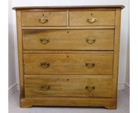 A late 19th/early 20thC James Shoolbred walnut dressing chest, the top having a thumb moulded edge, over panelled flanks, two