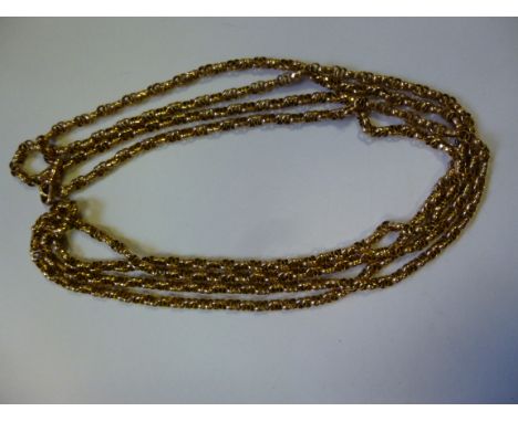 A gold coloured metal multi-ring link muff chain, on a dog clip clasp 