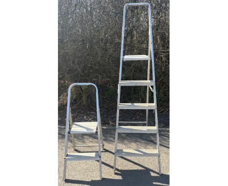 2 sets of aluminium step ladders, tallest pair measures approximately 68 inches