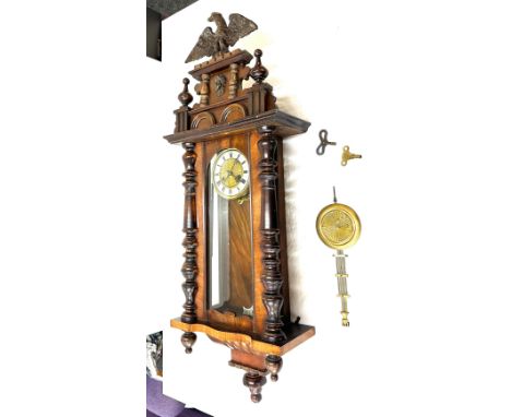 Victorian Vienna wall clock with two keys and pendulum measures approximately 43 inches tall x 16 wide and 7 deep