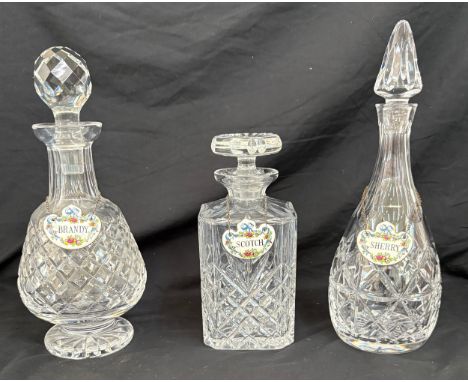 Three crystal decanters with Staffordshire Fine Bone China Crown drink labels Scotch, Sherry and Brandy