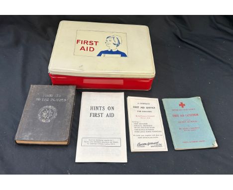 Vintage first aid box with contents and medical books 