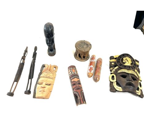 Selection of vintage African tribal wooden masks, largest measures approximately 12 inches tall by 8 wide
