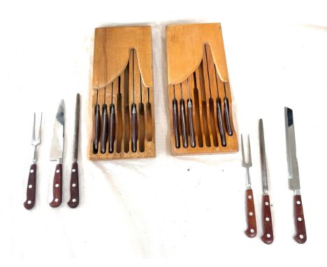 Two sets of vintage knifes in a wooden stand 