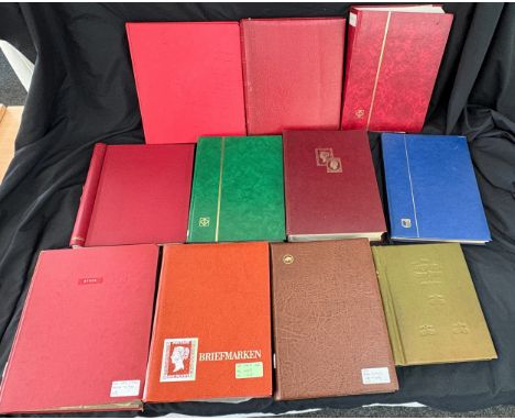 11 stamp albums with various assorted vintage and later stamps
