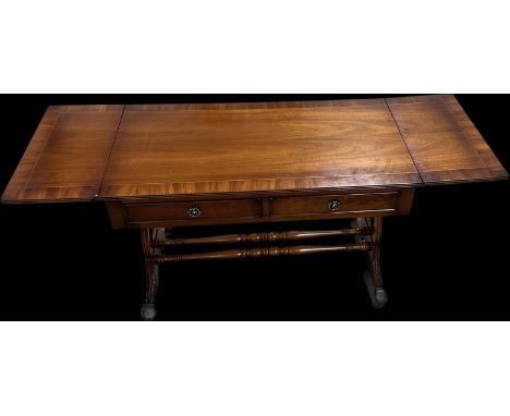 Mahogany two drawer drop leaf regency style side table measures approximately 23 inches tall x 55 long with leaf ups and 20 i