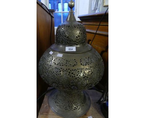 A large Islamic pierced brass lamp shade with removable lid 
