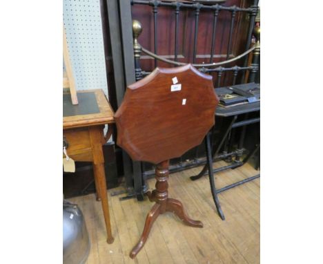 A small 19th Century mahogany tripod table, with shaped top, raised on a turned column and tripod base 