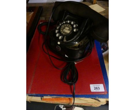 A vintage telephone, model no. RTT-56 together with a collection of vintage children's treasure magazines 
