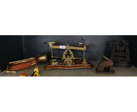A mixed lot comprising brass balance scales with weights, a further copper bugle marked Royal Welsh Fusiliers, a desk embosse