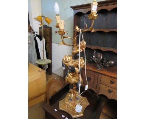 A reproduction Blackamoor three branch table lamp 