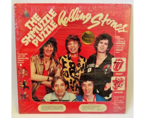 The Rolling Stones Shmuzzle Puzzle1983 US official licensed puzzle. The Shmuzzle Puzzle has pieces of one shape that fit toge