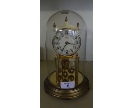 A Kundo dome topped torsion mantel clock 
