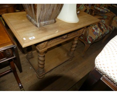 A light oak single drawer side table in the Gothic style raised on heavy barley twist legs with base shelf 