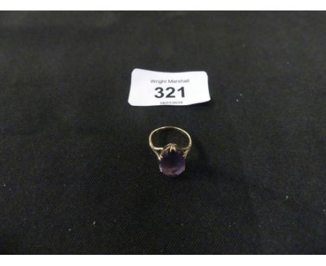 An amethyst single stone ring the oval shape amethyst with tapered shoulders, ring size K, weight approx. 2.9g.Some surface s