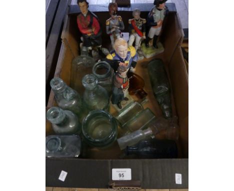 A mixed lot of various assorted vintage glass bottles together with modern porcelain military figures and a novelty teapot 