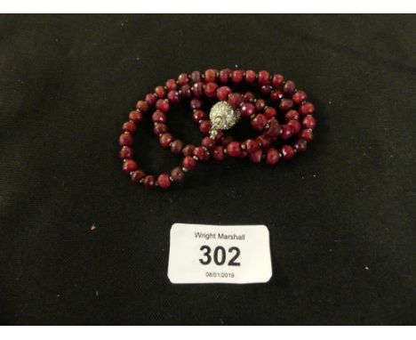 A ruby bead necklace, the faceted ruby beads with a magnetic paste clasp, length 52.5cm 