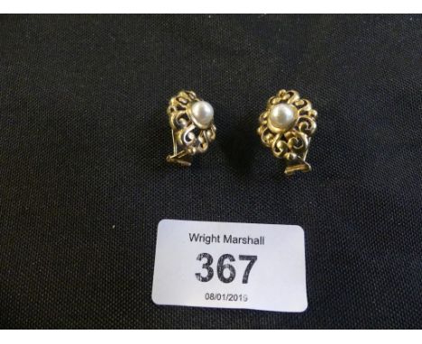A pair of 9ct gold cultured pearl earringsEach designed as a cultured pearl within a scrolling surround, weight approx. 5.1g.