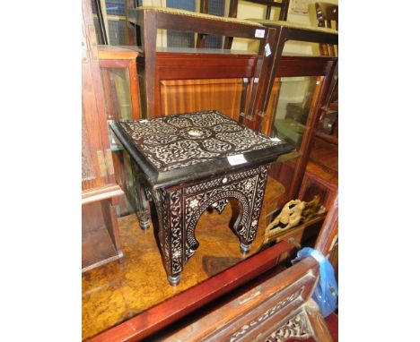 A small Anglo Indian hardwood occasional table with intricate carved and mother of pearl inlaid detail 