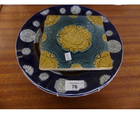 A mixed lot comprising a late 19th Century Mintons floral decorated tile, together with three Ashworth Bros decorated with Ch