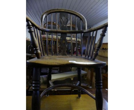 A 19th Century elm seated stick back Windsor type chair with crinoline stretcher 