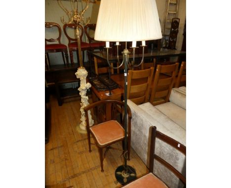 A modern bronzed metal four light standard lamp. 