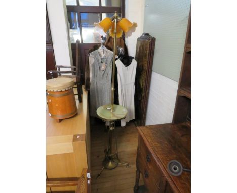 A brass and onyx three light standard lamp in the Art Nouveau style 