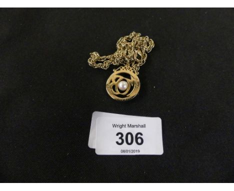 A cultured pearl pendantThe cultured pearl within an openwork circular surround, suspended from a fancy-link chain, total wei