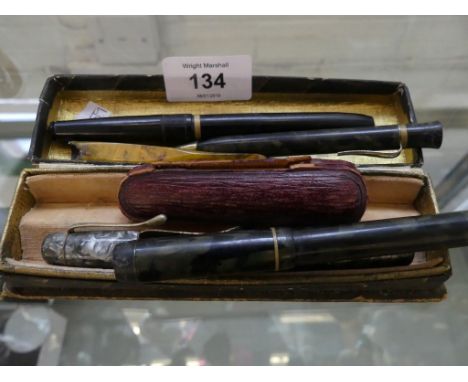 A collection of vintage fountain pens, propelling pencil, cheroot holders 