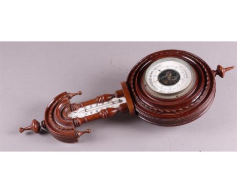A 1930's barometer with temperature indication, address: Arnoud Strucker, Breda, ca. 1920/30.H.: 47 cm. 