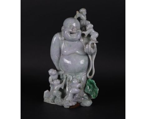 A jade sculpture of a Buddha with fools. China, 20th century.Afm.: 32 x 20 cm.