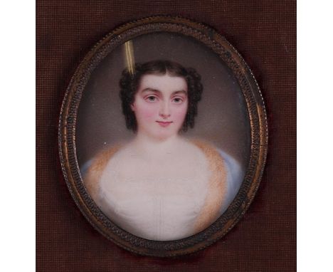 A hand-painted miniature portrait of a young lady. Approx. 1815.frame: 24 x 21 cm. 