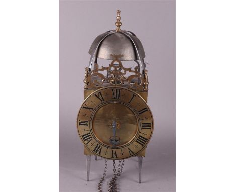 An 18th century brass and wrought iron verge escapement lantern clock.Afm.: 38 x 18 x 17 cm.