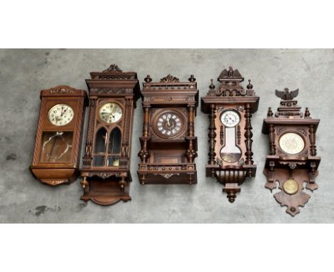 A lot of five regulator clocks. 19/20th century. The crest of the two rightmost bells is loose, they need to be glued. An eag