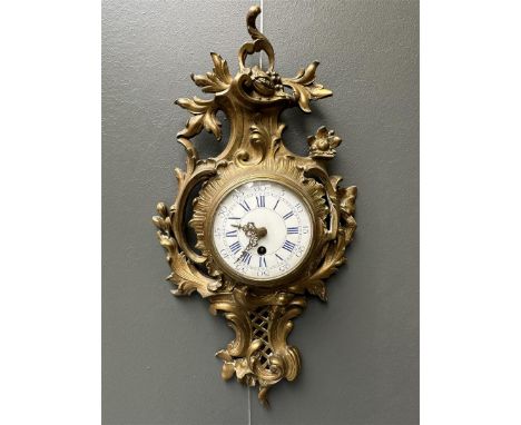 A Louis XV style cartel clock with enamel dial, ca. 1890. Movement tested and working.H.: 51 cm.