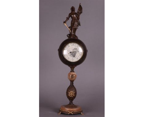 A large standing barometer with Jeane D'Arc on top, 19th century.H.: 66 cm. 