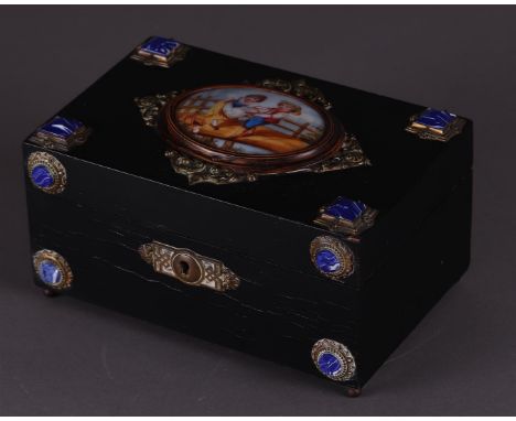 A black box with enamel plaque depicting children on a bridge. 19th century.9 x 18 x 11 cm. 