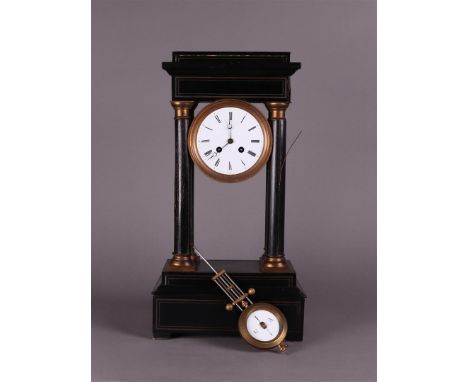 A black lacquered column clock. France late 19th centuryH.: 47 cm.