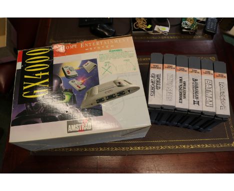 Vintage Amstrad GX400 in original box with various games inc Robo Cop 2 etc