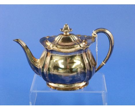 An Edwardian silver Teapot, by Atkin Brothers, hallmarked Sheffield, 1904, of lobed ovoid form with wavy rim, plain beaded ha