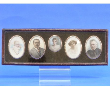 A set of five family portrait miniatures, early 20thC, oval photographic portraits over-painted in colours, framed and glazed